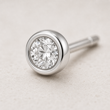 Single Stud earring in silver with bezel-set lab-grown diamond — angled view