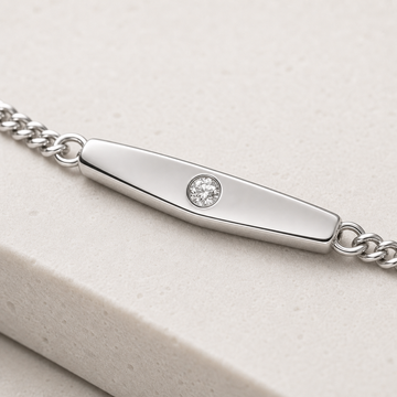 ID Bracelet in silver on a fine curb chain — angled view